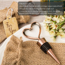 Heart shaped metal bottle stopper in a Copper plated finish  in a burlap bag