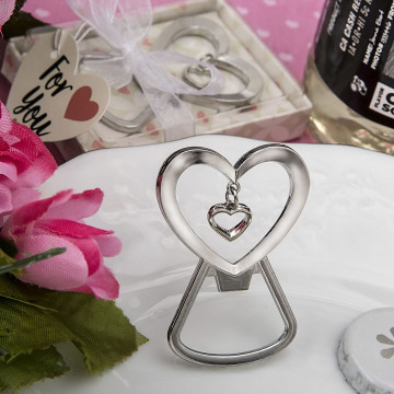 Heart shaped silver metal bottle opener with dangling heart design